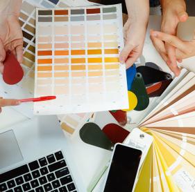 interior-designer-working-with-young-couple-lovely-family-professional-designer-architector-discussing-conept-future-interior-working-with-colour-palette-room-drawings-modern-office_cropped.jpg